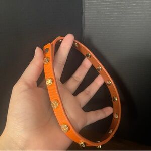 Orange Tory Burch wrap around leather bracelet
